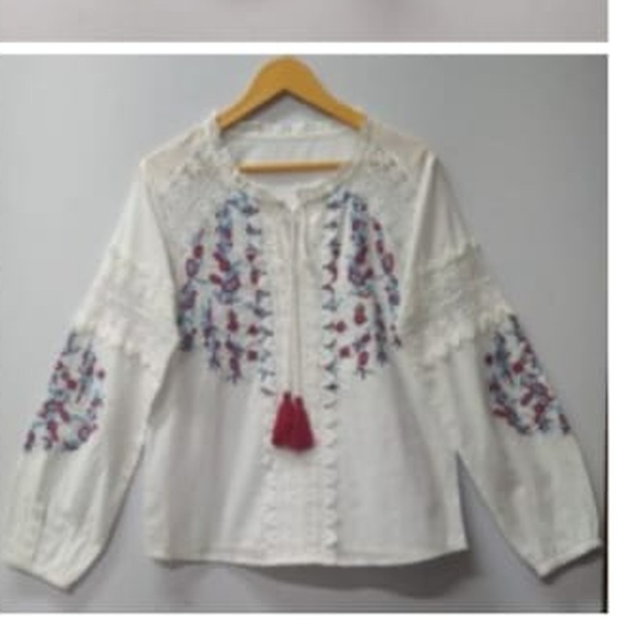 Embroidered ivory fabric detail