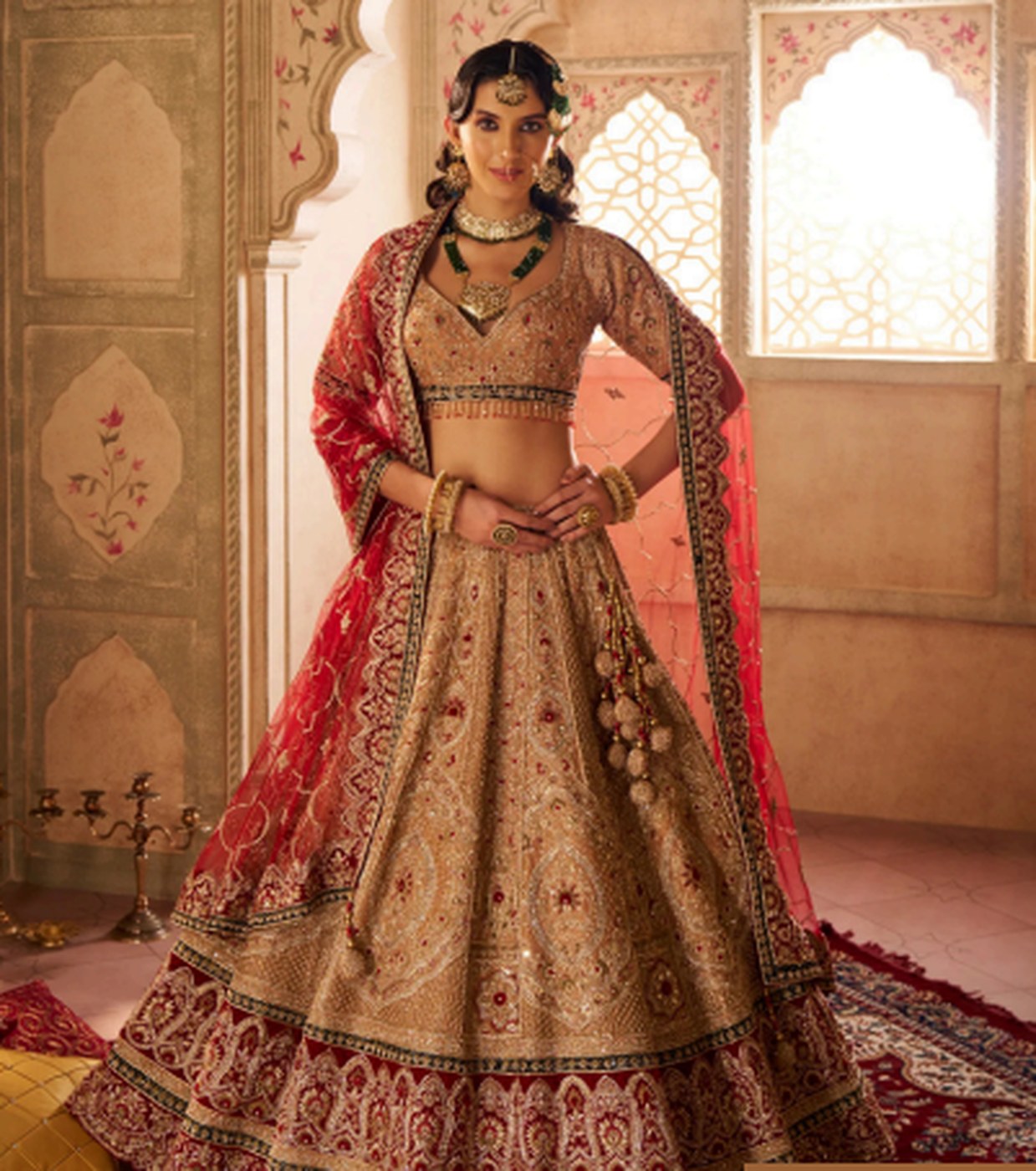 Heavily embroidered bridal lehenga in gold and red
